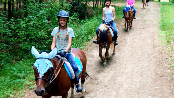 Kids riding horses